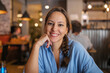 © Lupe Rodríguez/Stocksy - young caucasian woman in restaurant