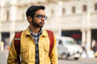 © Dream Lover/Stocksy - Portrait of an Indian man wearing yellow denim jacket at outdoors