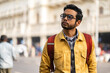 © Dream Lover/Stocksy - Portrait of an Indian man wearing yellow denim jacket at outdoors