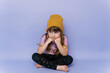 © Serena Burroughs/Stocksy - Stylish little toddler looking bored