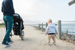 © Serena Burroughs/Stocksy - A father and son by the golden gate bridge with a stroller