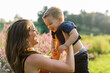 © Serena Burroughs/Stocksy - A smiling mother and her toddler son