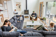 © Dylan Leeder/Stocksy - Family Quiet Time In Living Room