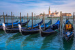 © Aide - Gondole docked by wooden mooring poles in grand canal, Ethereal Venice, Italy