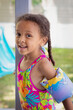 © anya brewley schultheiss/Stocksy - Smiling child who is ready to go to the pool