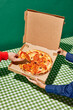 © Javier Díez/Stocksy - Anonymous person taking slice of pizza