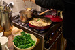 © Rowena Naylor/Stocksy - Cooking dinner at home