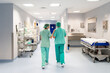 © Santi Nuñez/Stocksy - Medical team walking in the hospital