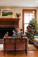 Young Girl Plays With Nutcracker Toys In Home During Christmas 