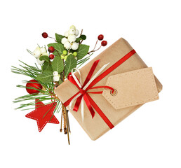 Wall Mural - Gift box with ribbon bow and a tag decorated with christmas twigs and holiday decorations isolated on white