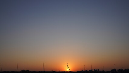 Wall Mural - the beautiful sunset view with the colorful clouds and sky in the city