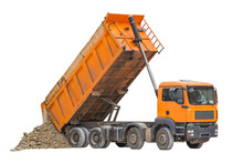 Unloading Soil From A Dump Truck. The Work Of Construction Equipment In The Production Of Earthworks
