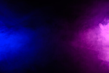 Wall Mural - smoke clouds in blue and purple neon light swirling on black table background with reflection