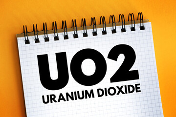 Poster - UO2 - uranium dioxide acronym text on notepad, abbreviation concept background