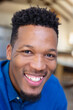 © Wavebreak Media - Portrait of happy african american man looking at camera and smiling