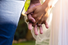 Midsection Of African American Couple Getting Married, Holding Hands During Wedding Day