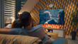 © Framestock - Couple on sofa in living room, watching action movie on TV or criminal blockbuster on streaming service, talking and discussing acting, resting at home on weekend. Home theater in modern apartment.