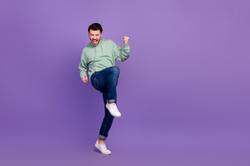 Sticker - Full body size photo of young successful businessman wear stylish outfit fists up enjoy crazy empty space new tournament isolated on violet color background