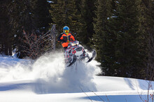 Snowmobile Fun. Sports Snow Bike With Snow Splashes And Snow Trail. Bright Snowmobile And Suit Without Brands. Snowmobilers Sports Riding. Stock Photo Very High Quality