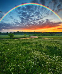  Rainbow over the meadow. picturesque spring morning. nature of Ukraine