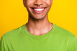 © deagreez - Close up photo of attractive young guy toothy smiling perfect healthy teeth dressed trendy green outfit isolated on yellow color background