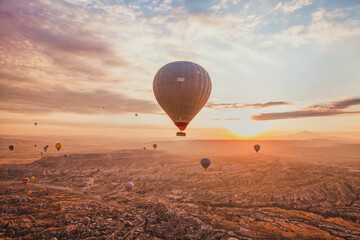 Wall Mural - travel, many hot air balloons flying in sunrise sky, beautiful landscape