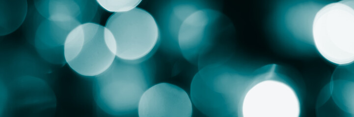 Blurred lights, dark blue background, banner texture. Abstract bokeh with soft light header. Wide screen wallpaper. Panoramic web banner with copy space for design