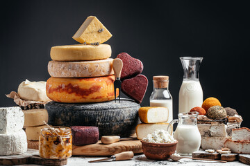 Wall Mural - Various kind of cheese. head of handcrafted hard cheese on a dark background