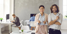 Happy Smiling Young Business People In Modern Office Workplace. Banner Background With Portrait Of Two Satisfied Successful Colleagues, Team Leaders, Teammates, Business Partners And Friends At Work