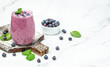 blueberry smoothie Yogurt fruit dessert on a light background. Berry smoothie. healthy dieting concept. Long banner format