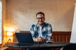 © bnenin - Portrait of a smiling businessman, posing for the camera while t