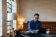 © bnenin - An adult man working at the office, using a laptop, working online.