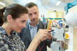 © auremar - woman electrician and mentor checking the voltage