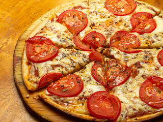 pizza with salami and tomatoes