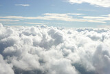 Fototapeta Na sufit - Aerial View from Airplane with City Scape below the Clouds