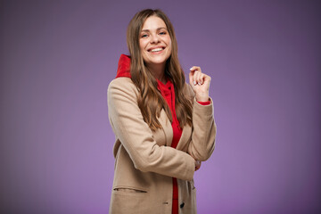 Wall Mural - Smiling female model in warm fall coat. Isolated advertising portrait.