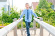 © Mitch Shark - boy ith blue shirt and tie walking on the bridge