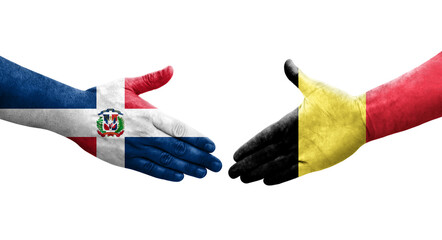 Handshake between Belgium and Dominican Republic flags painted on hands, isolated transparent image.