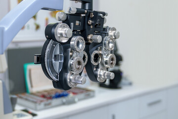 Phoropter, ophthalmic testing device machine on white background.half of phoropter used for background