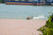 © Steve - A sailor drives a speedboat at the confluence of two rivers