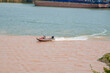 © Steve - A sailor drives a speedboat at the confluence of two rivers