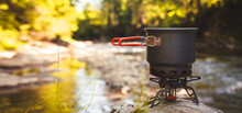 Cooking Food Using Camping Gas During The Hike.