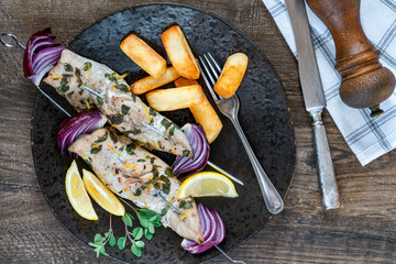 Canvas Print - Fish and chips with grilled mackerel kebabs