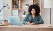 © Anela R/peopleimages.com - Laptop, black business woman writing in notebook or planning schedule or agenda for project management in office. Employee, manager or corporate worker with research for strategy innovation idea