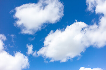 White clouds against the blue sky.