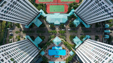 Top Down View Of Residential Apartment Building In Jakarta. Birds Eye View Skyscrapers