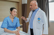 © Nassorn - Male doctor visit woman patient in hospital ward. Therapist wears lab coat talking, discussion with female patient about treatment and health recovery. Healthcare counseling concept.