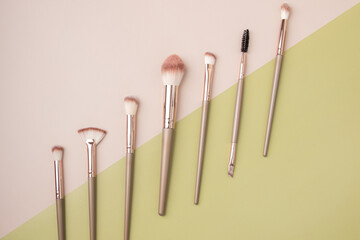 Wall Mural - makeup brushes, Set of professional decorative cosmetics, beauty accessories on a beige background