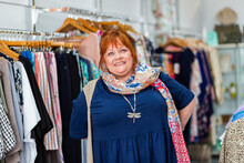 Smiling Portrait Of A Happy Middle Aged Woman In Clothing Boutique Store