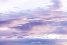 Pastel Purple And Pink Clouds In Sky At Dusk